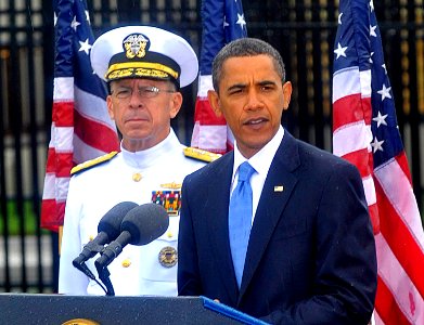 US Navy 090911-N-8273J-048 President Barack Obama delivers remarks during a Sept. 11 remembrance ceremony at the Pentagon Memorial as Adm. Mike Mullen, chairman of the Joint Chiefs of Staff looks on photo