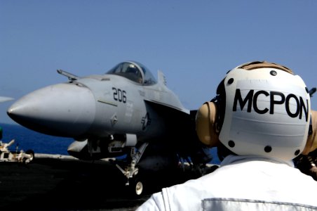 US Navy 090913-N-9818V-481 Master Chief Petty Officer of the Navy (MCPON) Rick West observes flight deck operations aboard the aircraft carrier USS Ronald Reagan (CVN 76). West is on a tour of the Central Command (CENTCOM) area