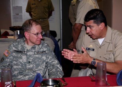 US Navy 090915-N-4936C-041 Brig. Gen. John J. Donnelly, Deputy Commander, 807th Medical Deployable Support Command, talks with Columbian Navy Rear Adm. Roberto Garcia Marquez aboard the amphibious transport dock ship USS Mesa V
