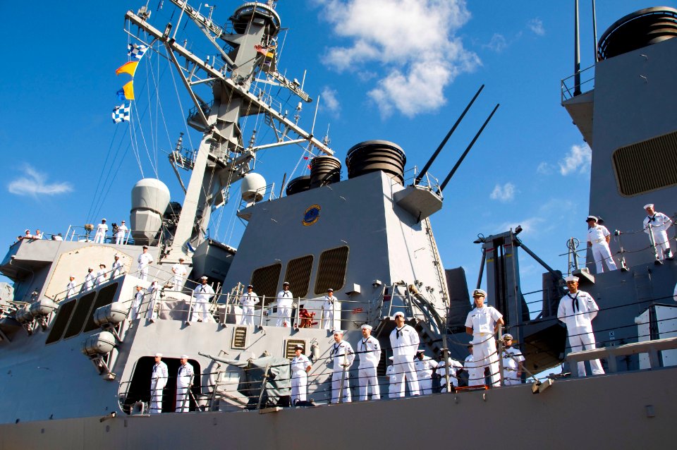 US Navy 090914-N-6674H-013 Sailors man the rails as the guided-missile destroyer USS O'Kane (DDG 77) departs Naval Station Pearl Harbor for a scheduled deployment to the U.S. 7th Fleet area of responsibility