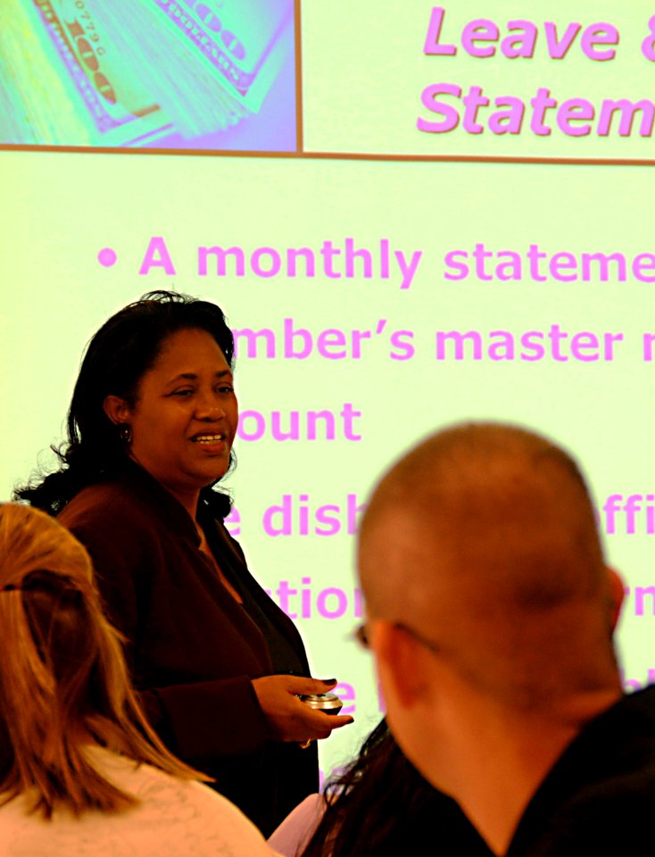 US Navy 090914-N-7498L-024 Janice Crawley, a financial counselor at Navy Region Hawaii's Fleet and Family Support Center (FFSC), speaks to Sailors and family members about military pay issues