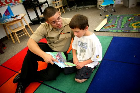 US Navy 090915-N-3271W-052 Personnel Specialist Seaman Johnell Torres of Navy Operational Support Center Reno reads with a student