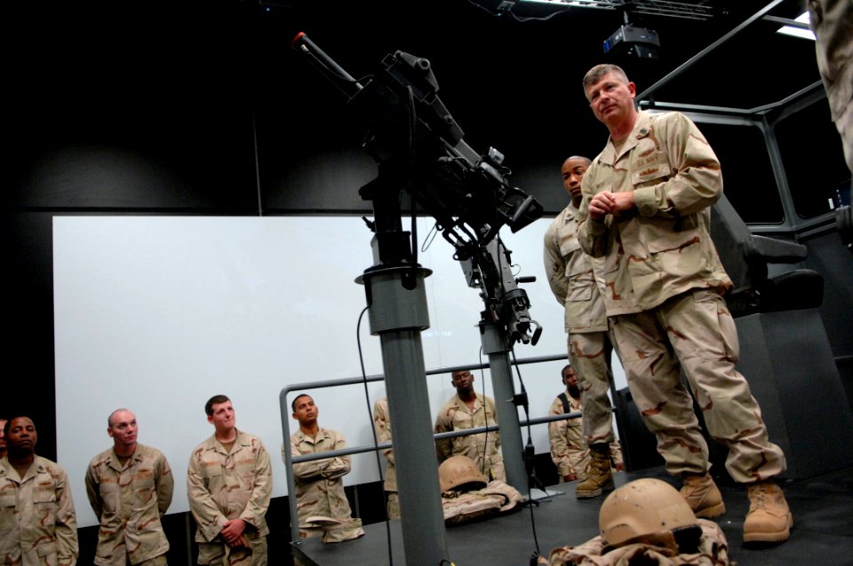 US Navy 090916-N-9818V-383 Master Chief Petty Officer of the Navy (MCPON) Rick West reviews the small boat simulator and talks with Sailors assigned to Commander Task Force (CTF) 56