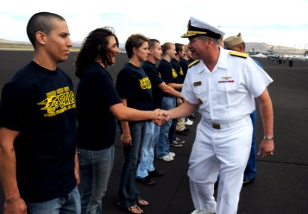 US Navy 090919-N-6220J-009 Rear Adm. Mark Fox, commander of the Naval Strike and Air Warfare Center, congratulates Delayed Entry Program enrollees after conducting their swearing-in ceremony at the Reno Air Races