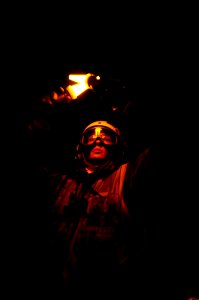 US Navy 090919-N-6538W-446 Aviation Boatswain's Mate (Handling) 3rd Class Cory Stallings, from Chicago, Ill., uses yellow flashlights to signal an aircraft to hold position prior to launching