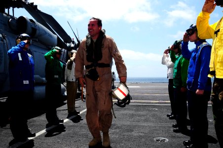 US Navy 090920-N-9760Z-001 Maj. Gen. Stephen Mueller, director of Air Component Coordination Element, Air Force Central Command in Kabul, Afghanistan, arrives through rainbow sideboys for a visit to the aircraft carrier USS Nim