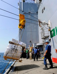 US Navy 090916-N-5345W-060 Deck department Sailors aboard the amphibious dock landing ship USS Fort McHenry (LSD 43) man their replenishment station as a load of stores arrives from Military Sealift Command fleet replenishment