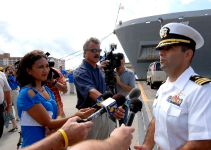 US Navy 090921-N-2456S-117 The guided-missile destroyer USS Bainbridge (DDG 96) Commanding Officer Cmdr. Frank Castellano, gives an interview to local media, after returning home to Naval Station Norfolk, Va