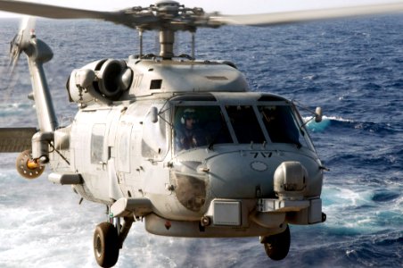 US Navy 090921-N-1251W-034 Lt. Phillip Hardway pilots the SH-60B Sea Hawk helicopter assigned to Warlord 717 of Helicopter Anti-Submarine Squadron Light (HSL) 51, off the deck of the guided-missile destroyer USS Lassen (DDG 82)