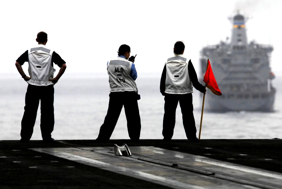 US Navy 090918-N-6538W-053 Quartermasters aboard the Nimitz-class aircraft carrier USS John C. Stennis (CVN 74) mark and report the distance between John C. Stennis and the Military Sealift Command
