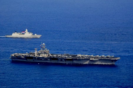 US Navy 090917-N-8907D-147 he aircraft carrier USS Harry S. Truman (CVN 75) and the Royal Netherlands navy frigate HNLMS Tromp (F803) transit in formation during a group sail