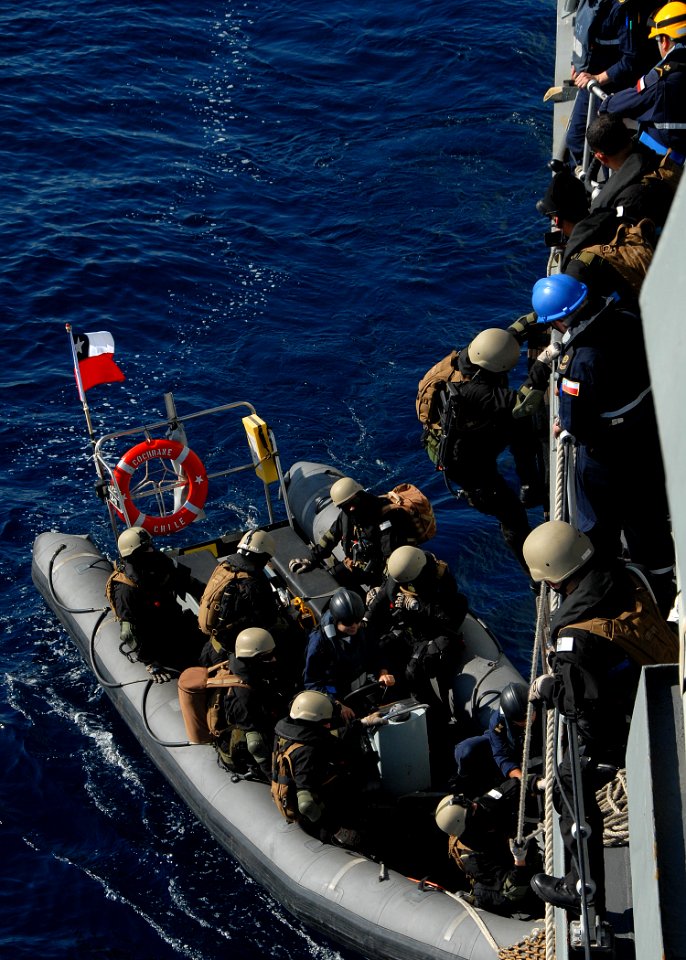 US Navy 090918-N-2821G-094 Boarding team members from the Chilean frigate CNS Cochrane (FF 05) board a rigid hull inflatable boat (RHIB) during a proliferation security initiative event that is part of the multinational trainin