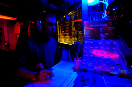 US Navy 090919-N-6538W-466 Aviation Boatswain's Mate (Fuels) Airman Jacob Welch, from Dallas, Texas, stands the aviation fuels representative watch in flight deck control