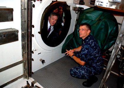US Navy 090923-N-8750E-097 Secretary of the Navy (SECNAV) the Honorable Ray Mabus, looks into the lock-out chamber of the Virginia-class attack submarine USS New Hampshire (SSN 778)