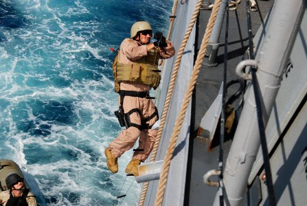 US Navy 090924-N-0789J-236 The visit, board, search and seizure (VBSS) team, assigned to the guided-missile cruiser USS Anzio (CG 68) and U.S. Coast Guard Maritime Safety and Security Team 91104 board the Anzio during a simulat