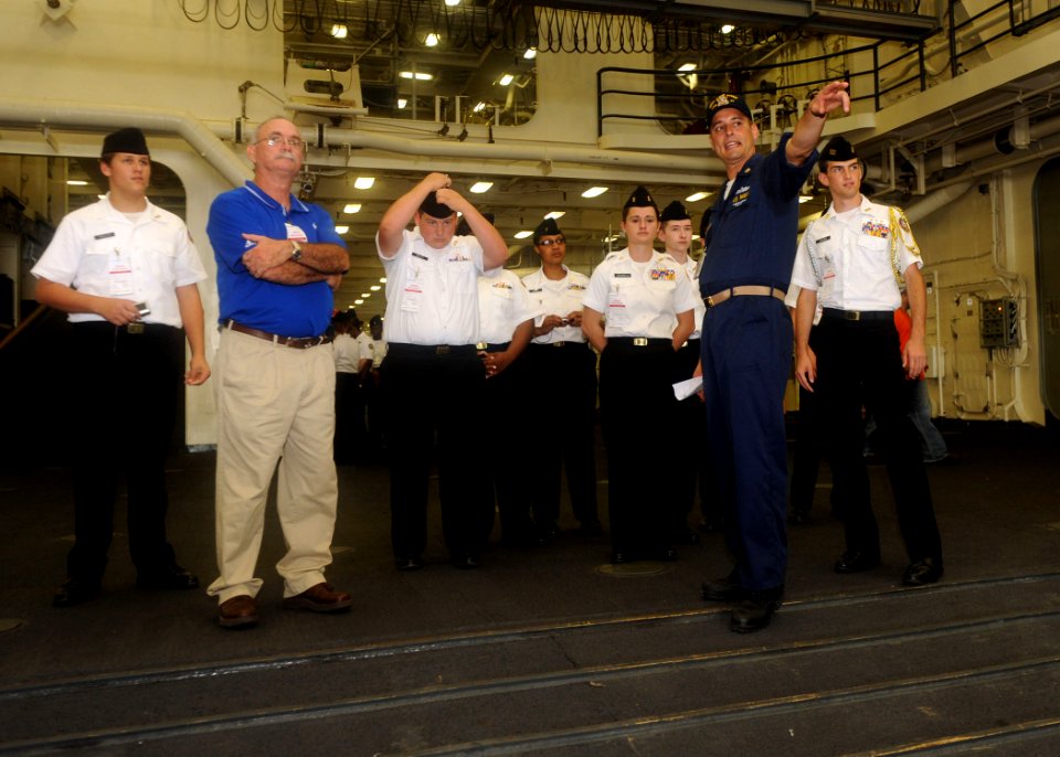 US Navy 090924-N-2147L-001 Master Chief Information Systems Technician Sean Stewart gives a tour of the dock landing ship Pre-Commissioning Unit (PCU) New York (LPD 21)