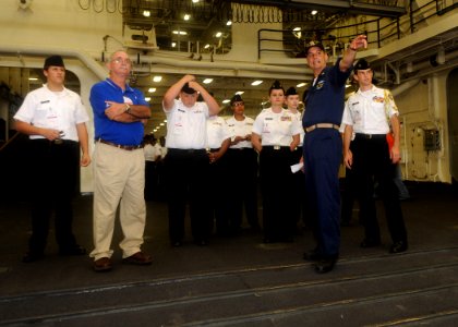 US Navy 090924-N-2147L-001 Master Chief Information Systems Technician Sean Stewart gives a tour of the dock landing ship Pre-Commissioning Unit (PCU) New York (LPD 21)