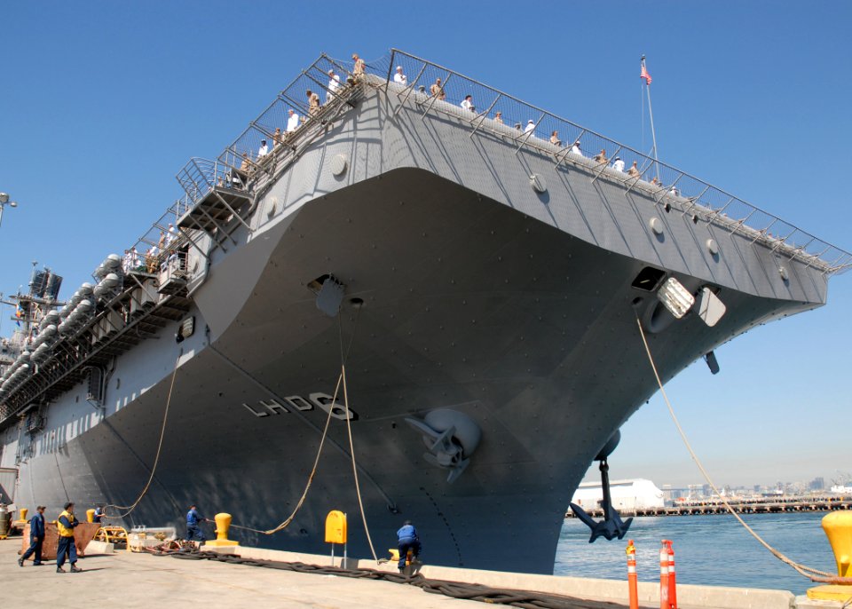 US Navy 090924-N-8283S-168 Sailors and embarked Marines man the rails as the amphibious assault ship USS Bonhomme Richard (LHD 6) gets underway from Naval Base San Diego