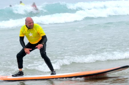 US Navy 090925-N-5969B-188 Wounded Coast Guard veteran Stephen Bruggeman surfs at La Jolla Shores in San Diego during the National Veterans Summer Sports Clinic