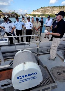 US Navy 090922-N-6138K-591 During an oil spill preparedness course, Paul Cronenberger, spill response manager at Naval Support Activity Souda Bay, explains the proper procedures when using the inclined belt plane