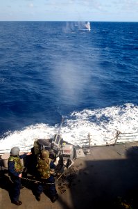 US Navy 090924-N-1251W-170 Sailors assigned to the guided-missile destroyer USS Lassen (DDG 82) fire an MK 38 25mm machine gun at a Killer Tomato target during exercise Multi-Sail in the western Pacific Ocean