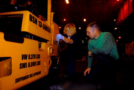 US Navy 090919-N-2475A-082 Aviation Support Equipment Technician Airman Apprentice Amanda Cooke, performs preventive maintenance on a forklift