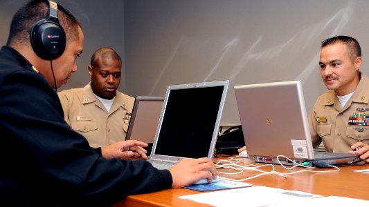 US Navy 090924-N-9909Y-005 Chief Personnel Specialist Romel Agliam, Personnel Specialist 2nd Class Ross Wharton, and Chief Personnel Specialist Gabriel Powers