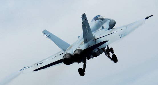US Navy 090919-N-6538W-091 An F-A-18C Hornet assigned to the Rough Raiders of Strike Fighter Squadron (VFA) 125 launches from the flight deck of the aircraft carrier USS John C. Stennis
