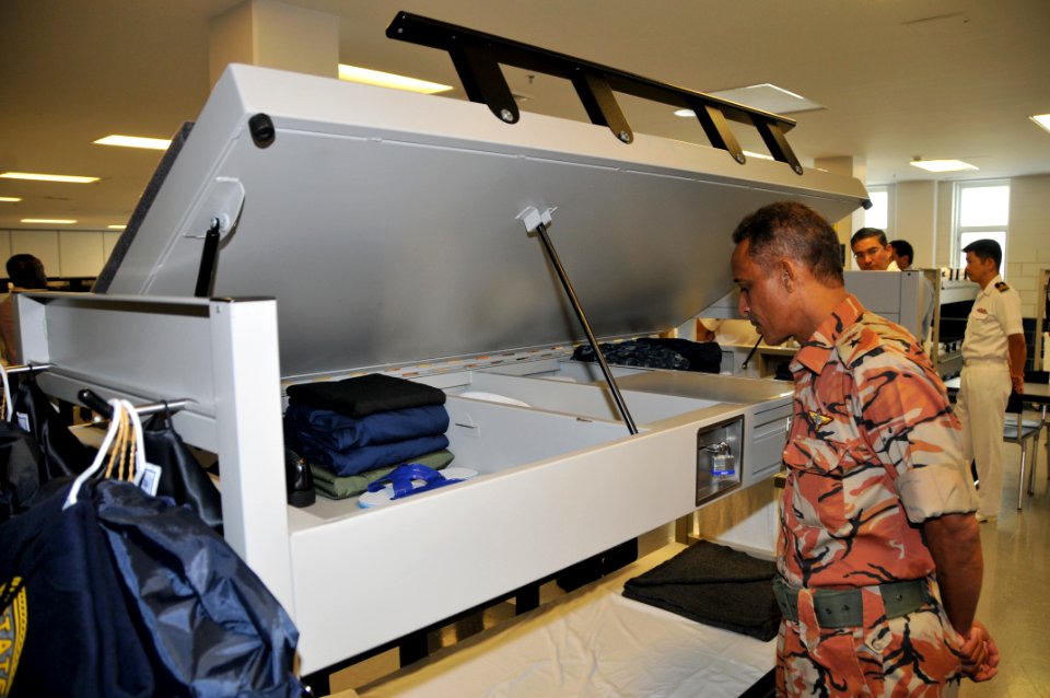 US Navy 090925-N-8848T-696 Lt. Col. Saif Said Al Hajri, from the Sultan's Armed Forces of Oman, looks into the locker of a recruit's rack in a barracks at Recruit Training Command