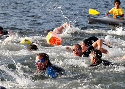 US Navy 090926-N-2013O-009 Sailors and other members of the Yokosuka community start the 400-meter swim leg of the Salty Dog Sprint Triathlon at the Green Bay Marina