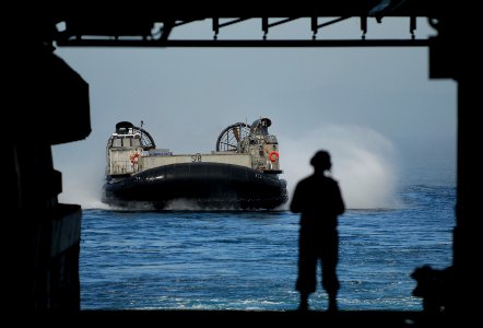 US Navy 090923-N-0807W-172 Landing Craft, Air Cushion (LCAC) 58 assigned to Assault Craft Unit (ACU) 5 prepares to enter the well deck photo