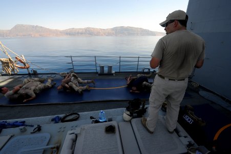 US Navy 090926-N-4154B-257 A combined team of U.S. Navy visit, board, search and seizure team members from the guided-missile cruiser USS Anzio (CG 68) and members of U.S. Coast Guard Maritime Safety and Security Team conduct w photo