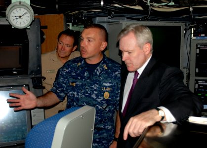 US Navy 090923-N-8750E-104 Chief of the Boat, describes the fly-by-wire ship control system of the Virginia-class attack submarine USS New Hampshire