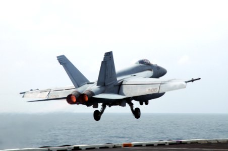 US Navy 090927-N-3038W-090 An F-A-18C Hornet assigned to the Tophatters of Strike Fighter Squadron (VFA) 14 launches from the flight from the flight deck of the aircraft carrier USS Nimitz (CVN 68)