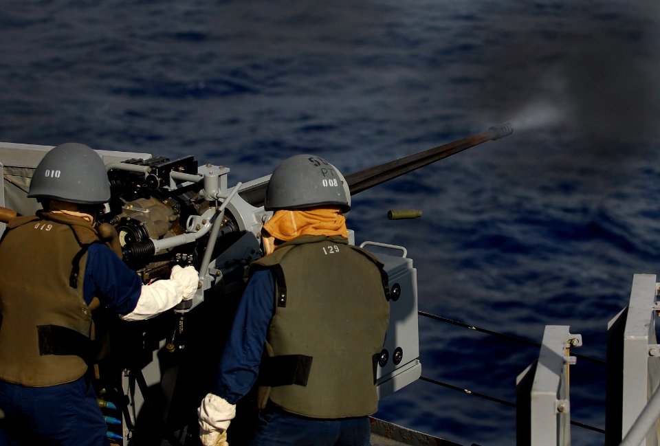US Navy 090924-N-0807W-012 Sailors aboard the amphibious dock landing ship USS Harpers Ferry (LSD 49) fire an MK-38 25mm machine gun