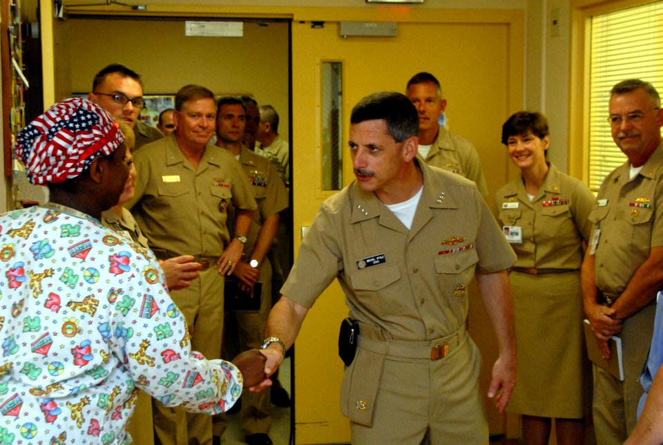 US Navy 090928-N-3289C-085 Vice Adm. Michael Vitale, commander, Navy Installations Command, meets with Lt. j.g. Teri Ryals during a tour of the Naval Hospital Rota maternity ward