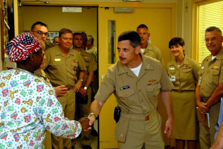 US Navy 090928-N-3289C-085 Vice Adm. Michael Vitale, commander, Navy Installations Command, meets with Lt. j.g. Teri Ryals during a tour of the Naval Hospital Rota maternity ward