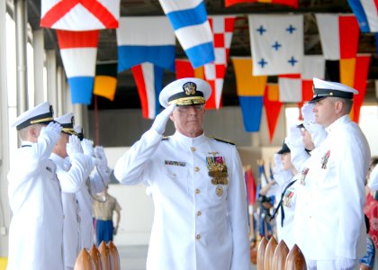 US Navy 090925-N-5476H-046 Adm. Robert. F. Willard renders a salute as he passes through side boys during a change of command ceremony at Naval Station Pearl Harbor