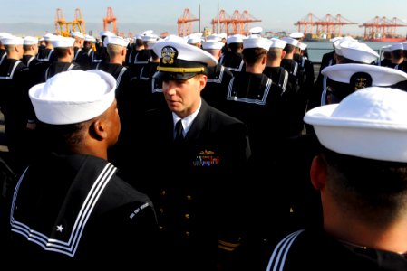 US Navy 090925-N-5345W-026 Chief Engineer Lt. Christopher Barnes addresses a Sailor during an all hands uniform inspection aboard the amphibious dock landing ship USS Fort McHenry (LSD 43) during a port visit to Salalah, Oman