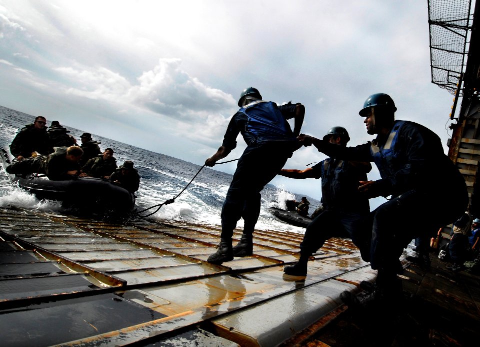 US Navy 090929-N-0807W-280 Sailors assigned to the amphibious dock landing ship USS Harpers Ferry (LSD 49) embark Marines from 31st Marine Expeditionary Unit (31st MEU) during combat rubber raid craft exercises