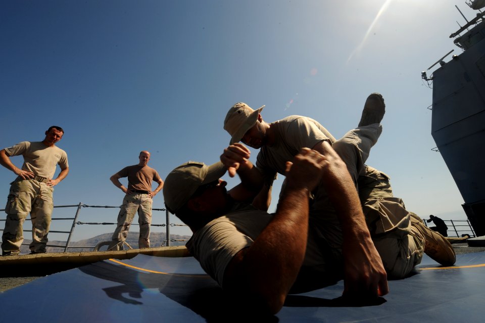 US Navy 090926-N-4154B-247 A combined team of U.S. Navy visit, board, search and seizure team members from the guided-missile cruiser USS Anzio (CG 68) and members of U.S. Coast Guard Maritime Safety and Security Team conduct w
