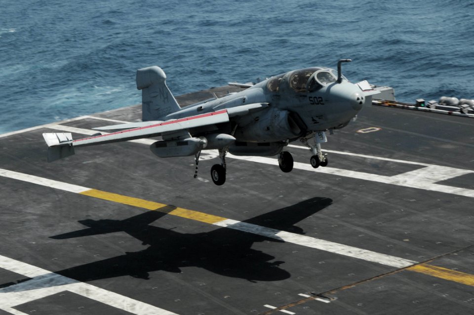 US Navy 090929-N-3038W-149 An EA-6B Prowler assigned to the Black Ravens of Tactical Electronic Attack Squadron (VAQ) 135 lands aboard the aircraft carrier USS Nimitz (CVN 68)