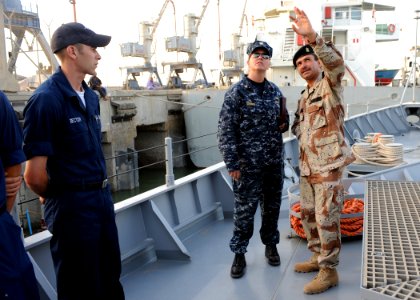 US Navy 090929-N-7088A-216 Lt. Cmdr. Jennifer Forbus, commanding officer of the mine countermeasures ship USS Dextrous (MCM 13) and her crew, tour the Iraqi ship the Fateh with Iraqi navy Capt. Ali Meta'ab Glass in Umm Qasr, Ir