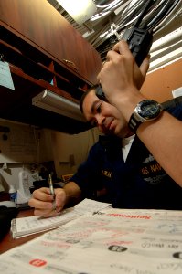 US Navy 090930-N-4053P-017 Lt. j.g. Rafael Villarreal, ship's secretary aboard the aircraft carrier USS Nimitz (CVN 68), coordinates the schedules for the commanding officer and the executive officer with other department heads