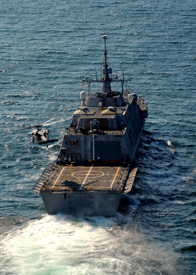 US Navy 090928-N-7241L-149 The littoral combat ship USS Freedom (LCS 1) conducts flight deck certification with an MH-60S Sea Hawk helicopter assigned to the Sea Knights of Helicopter Sea Combat Squadron (HSC) 22