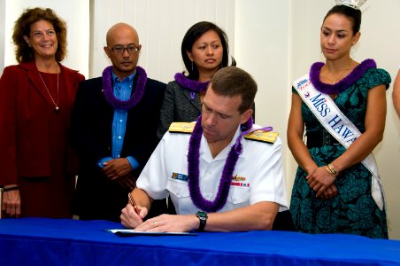 US Navy 090928-N-6674H-008 Rear Adm. Dixon R. Smith, commander of Navy Region Hawaii and commander of Naval Surface Group Middle Pacific, signs a domestic violence proclamation at the Fleet and Family Support Center at Naval St