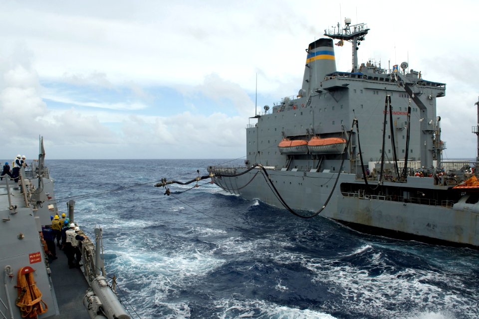 US Navy 090928-N-9123L-022 The guided-missile destroyer USS McCampbell (DDG 85) receives a fuel line from the Military Sealift Command fleet replenishment oiler USNS Pecos (T-AO-197) during a refueling at sea