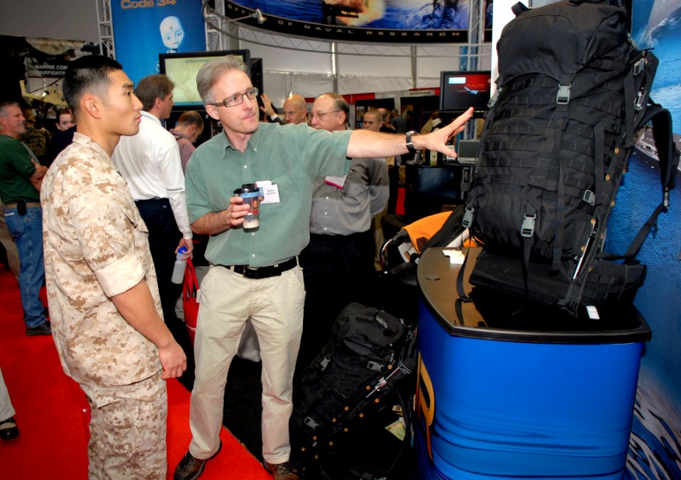 US Navy 090930-N-7676W-011 Marty Belcher, lead designer and developer of the Office of Naval Research-funded Lightning Pack, explains the benefits of the ergonomic and electricity generating backpac