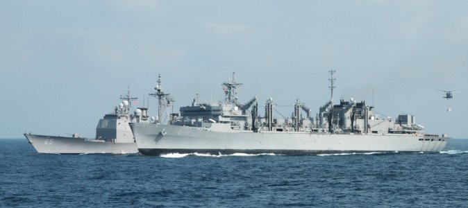 US Navy 091001-N-3038W-310 The military sealift command fast combat support ship USNS Bridge (T-AOE 10) is underway alongside the aircraft carrier USS Nimitz (CVN 68) during a replenishment at sea