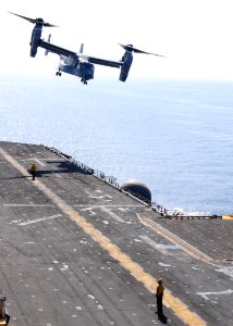 US Navy 091002-N-3165S-281 An MV-22B Osprey assigned to Marine Medium Tiltrotor Squadron (VMM) 263 (Reinforced), 22nd Marine Expeditionary Unit (22nd MEU), takes off from the flight deck of the multi-purpose amphibious assault photo